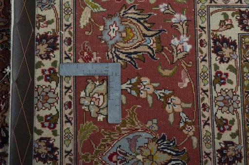 Backside of handmade New Tabriz 50/60/70 Raj rug showing knot structure and weave density