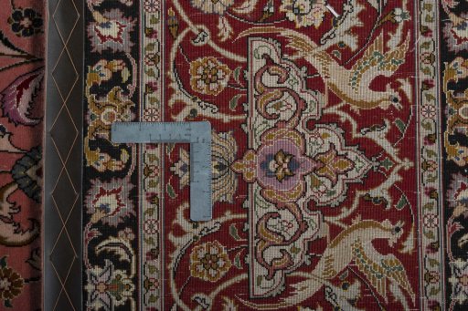 Backside of handmade New Tabriz 50/60/70 Raj rug showing knot structure and weave density