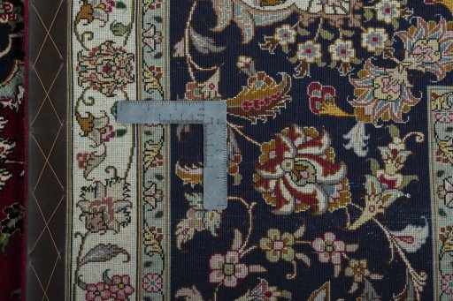 Backside of handmade New Tabriz 50/60/70 Raj rug showing knot structure and weave density