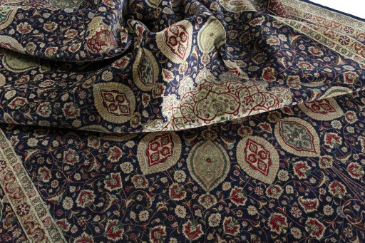 Surface texture of 1950s Tabriz 50/60/70 Raj rug with natural Cork and intricate pattern