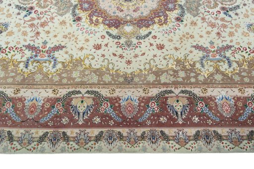 Corner detail of 2000s Tabriz 50/60/70 Raj rug showing border pattern and Cork pile