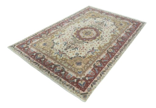 Corner detail of 2000s Tabriz 50/60/70 Raj rug showing border pattern and Cork pile