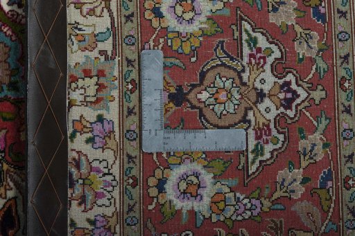 Backside of handmade New Tabriz 50/60/70 Raj rug showing knot structure and weave density