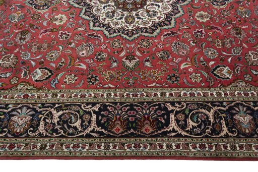 Corner detail of 2000s Tabriz 50/60/70 Raj rug showing border pattern and Cork pile