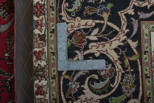 Backside of handmade 2000s Tabriz 50/60/70 Raj rug showing knot structure and weave density