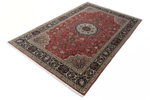 Corner detail of 2000s Tabriz 50/60/70 Raj rug showing border pattern and Cork pile