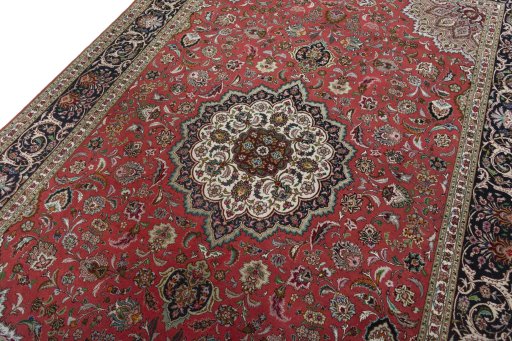 Backside of handmade 2000s Tabriz 50/60/70 Raj rug showing knot structure and weave density