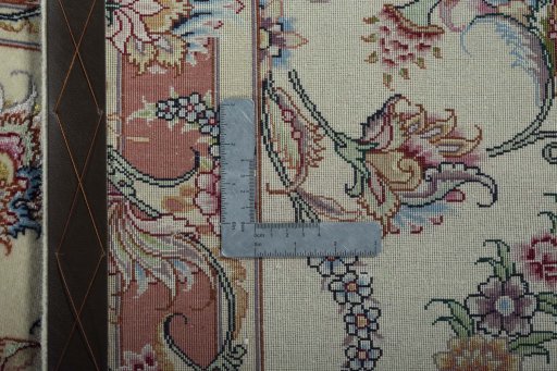Backside of handmade 2000s Tabriz 50/60/70 Raj rug showing knot structure and weave density