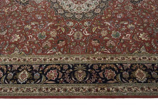 Corner detail of 2000s Tabriz 50/60/70 Raj rug showing border pattern and Cork pile