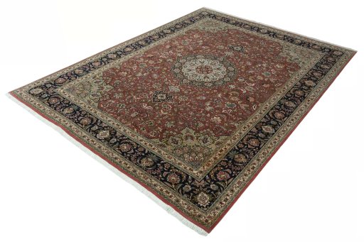 Corner detail of 2000s Tabriz 50/60/70 Raj rug showing border pattern and Cork pile