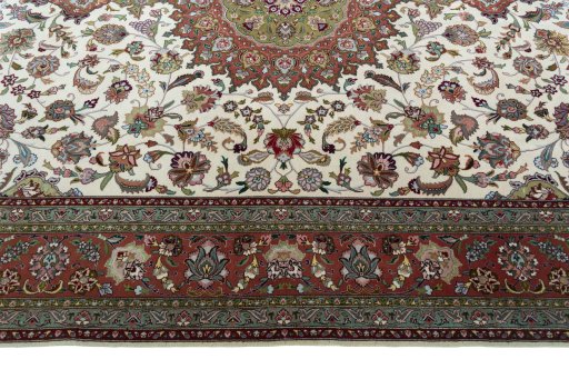 Corner detail of 2000s Tabriz 50/60/70 Raj rug showing border pattern and Cork pile