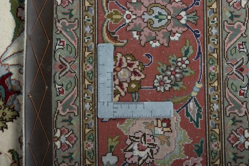 Backside of handmade 2000s Tabriz 50/60/70 Raj rug showing knot structure and weave density