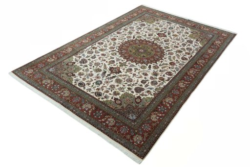 Corner detail of 2000s Tabriz 50/60/70 Raj rug showing border pattern and Cork pile