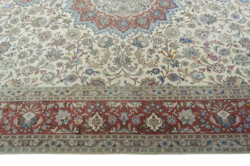 Corner detail of 2000s Tabriz 50/60/70 Raj rug showing border pattern and Cork pile