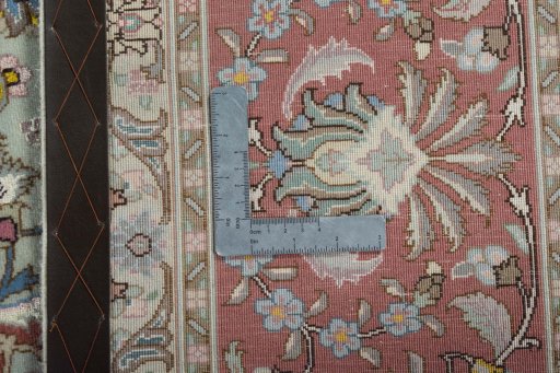 Backside of handmade 2000s Tabriz 50/60/70 Raj rug showing knot structure and weave density