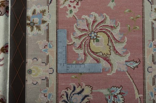 Backside of handmade New Tabriz 50/60/70 Raj rug showing knot structure and weave density