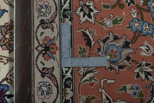 Backside of handmade New Tabriz 50/60/70 Raj rug showing knot structure and weave density