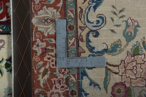 Backside of handmade 2000s Tabriz 50/60/70 Raj rug showing knot structure and weave density