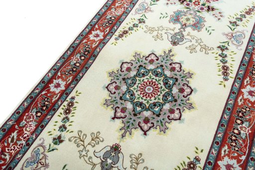 Backside of handmade 2000s Tabriz 50/60/70 Raj rug showing knot structure and weave density