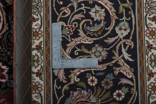 Backside of handmade New Tabriz 50/60/70 Raj rug showing knot structure and weave density