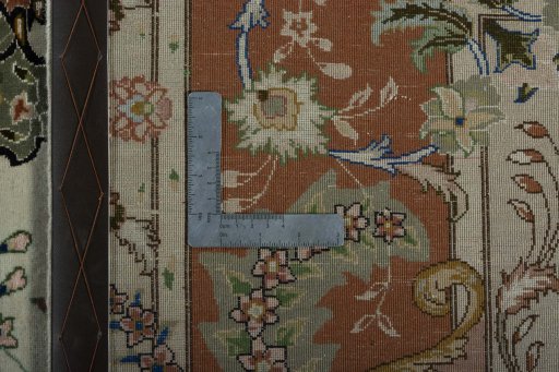 Backside of handmade New Tabriz 50/60/70 Raj rug showing knot structure and weave density