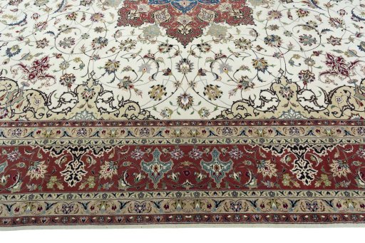 Corner detail of 2000s Tabriz 50/60/70 Raj rug showing border pattern and Cork pile