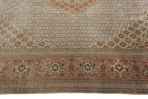 Corner detail of 2000s Tabriz 50/60/70 Raj rug showing border pattern and Cork pile