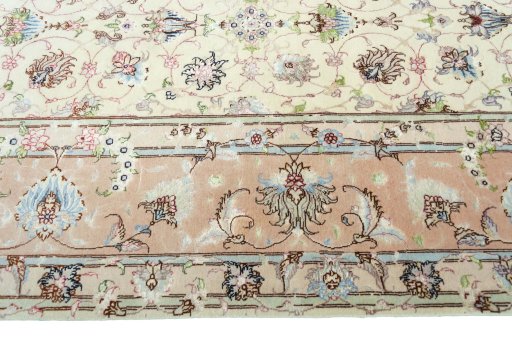 Corner detail of 2000s Tabriz 50/60/70 Raj rug showing border pattern and Cork pile