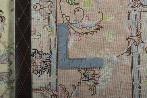 Backside of handmade 2000s Tabriz 50/60/70 Raj rug showing knot structure and weave density