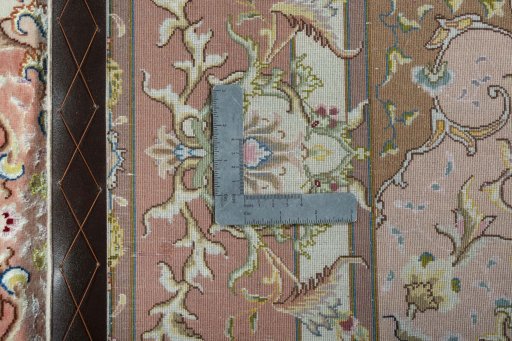 Backside of handmade 2000s Tabriz 50/60/70 Raj rug showing knot structure and weave density