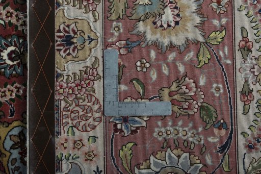 Backside of handmade 2000s Tabriz 50/60/70 Raj rug showing knot structure and weave density