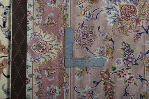 Backside of handmade 2000s Tabriz 50/60/70 Raj rug showing knot structure and weave density