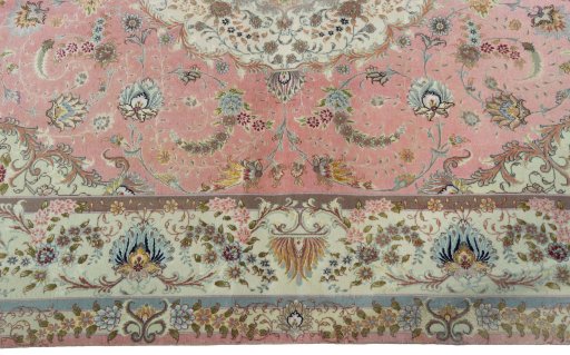Corner detail of 2000s Tabriz 50/60/70 Raj rug showing border pattern and Cork pile