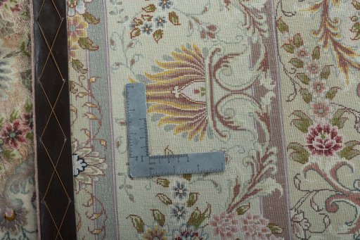 Backside of handmade 2000s Tabriz 50/60/70 Raj rug showing knot structure and weave density