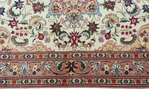 Corner detail of 2000s Tabriz 50/60/70 Raj rug showing border pattern and Cork pile