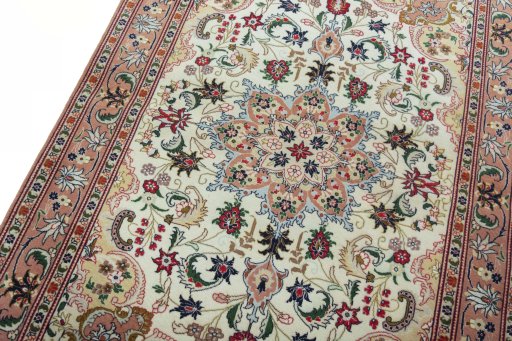 Backside of handmade 2000s Tabriz 50/60/70 Raj rug showing knot structure and weave density