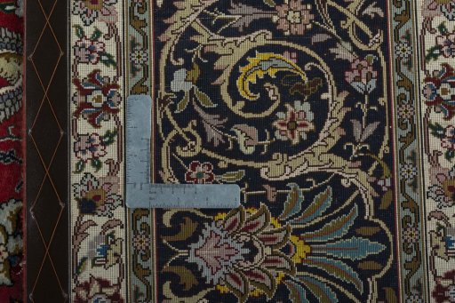 Backside of handmade 2000s Tabriz 50/60/70 Raj rug showing knot structure and weave density
