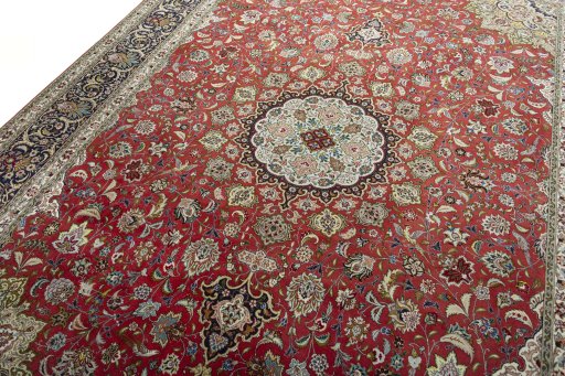 Backside of handmade 2000s Tabriz 50/60/70 Raj rug showing knot structure and weave density