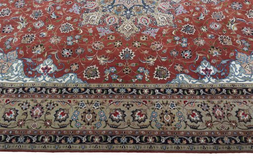 Corner detail of 2000s Tabriz 50/60/70 Raj rug showing border pattern and Cork pile