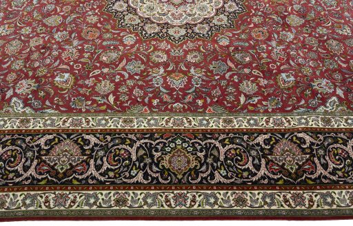 Corner detail of 2000s Tabriz 50/60/70 Raj rug showing border pattern and Cork pile