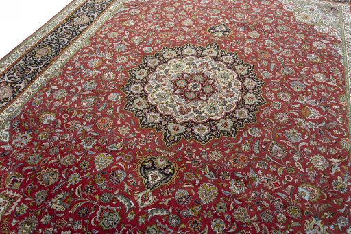 Backside of handmade 2000s Tabriz 50/60/70 Raj rug showing knot structure and weave density