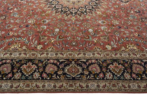 Corner detail of 2000s Tabriz 50/60/70 Raj rug showing border pattern and Cork pile
