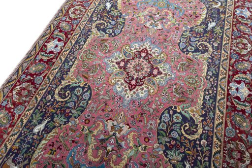 Backside of handmade 2000s Tabriz 50/60/70 Raj rug showing knot structure and weave density