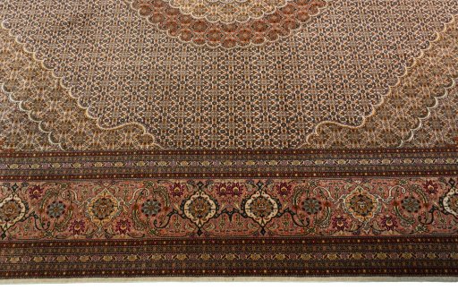 Corner detail of 2000s Tabriz 50/60/70 Raj rug showing border pattern and Cork pile