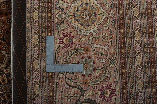 Backside of handmade 2000s Tabriz 50/60/70 Raj rug showing knot structure and weave density