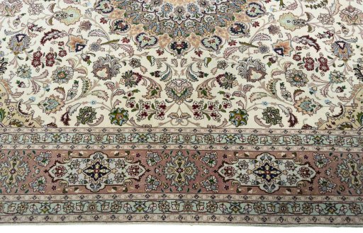 Corner detail of 2000s Tabriz 50/60/70 Raj rug showing border pattern and Cork pile