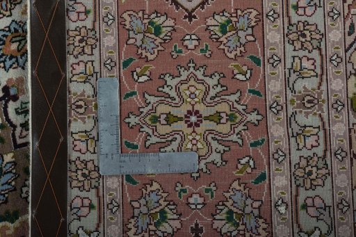 Backside of handmade 2000s Tabriz 50/60/70 Raj rug showing knot structure and weave density