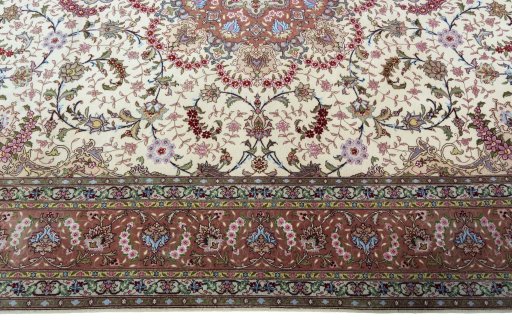 Corner detail of 2000s Tabriz 50/60/70 Raj rug showing border pattern and Cork pile