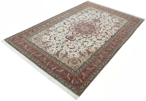 Corner detail of 2000s Tabriz 50/60/70 Raj rug showing border pattern and Cork pile