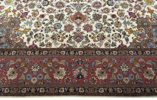 Corner detail of 2000s Tabriz 50/60/70 Raj rug showing border pattern and Cork pile